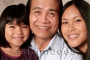 Asia Images Group - Mature man with young woman and young girl, portrait