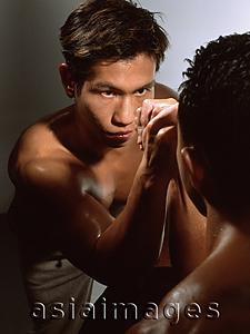 Asia Images Group - Two men arm wrestling