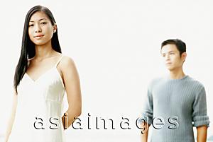 Asia Images Group - Portrait of woman with man in background