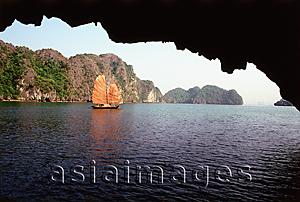 Asia Images Group - Vietnam, Halong Bay, Fishing junk amongst the islands viewed from a cave