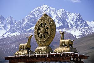 Asia Images Group - China, Szechuan (Sichuan), Kham region, Buddhist icon with mountains in background.