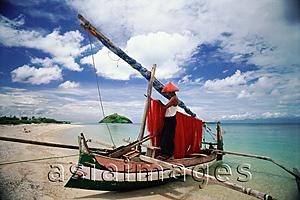 Asia Images Group - Indonesia, Lombok, Fisherman tending nets on beach