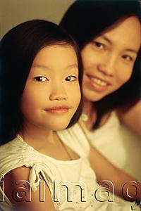 Asia Images Group - Young girl with mother in background, portrait
