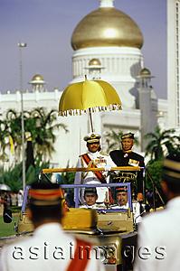 Asia Images Group - Brunei, Sultan Hassanal Bolkiah watches a military ceremony in honor of his birthday from a reviewing stand.