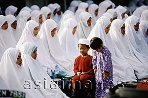 Asia Images Group - Malaysia, Kota Bharu, Children accompany their mothers during Friday prayer at Kubang Kerian Mosque.