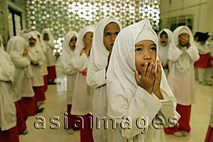 Asia Images Group - Malaysia, Kuala Lumpur, young children praying together at an Islamic kindergarten at the National Mosque.
