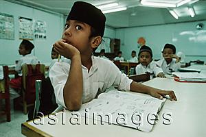 Asia Images Group - Malaysia, Kuala Lumpur, young Muslim boy in class at the National Mosque.