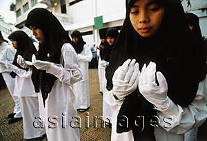 Asia Images Group - Indonesia, Jakarta, Muslim students offering prayers and ask for blessings on their country.