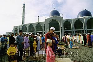 Asia Images Group - Malaysia, Kota Bharu, Fathers and sons standing in neat rows at Kubang Kerian Mosque during Friday prayers.