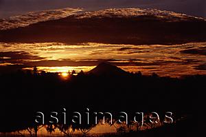 Asia Images Group - Indonesia, Sumatra, Aceh, The sun setting over the mountains.