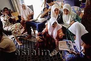 Asia Images Group - Malaysia, Kota Bharu, a Muslim family passes the Hari Raya Adilfitri holiday.