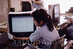 Asia Images Group - Vietnam, Ho Chi Minh City, Women working in a factory checking television sets.