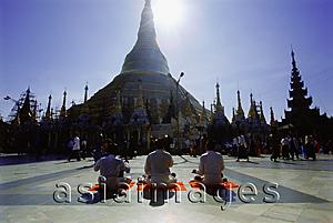 Asia Images Group - Myanmar (Burma), Yangon (Rangoon), Silhouette of worshippers praying at the Shwedagon Pagoda