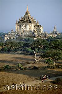 Asia Images Group - Myanmar (Burma), Bagan, Villagers walking along dirt roads with temples in backgrounds