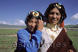 Asia Images Group - China, Szechuan (Sichuan), Kham region, Nomad girls in traditional decorations of turquoise and coral