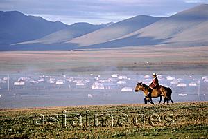Asia Images Group - China, Szechuan (Sichuan), Kham region, Summer nomad festival, horseman in early morning near tent city.