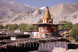 Asia Images Group - Nepal, Mustang, Ancient chortens, mountains in background.