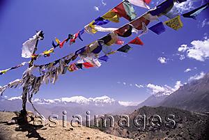 Asia Images Group - Nepal, Mustang, Prayer flags at the top of trail, Annapurna Range in background.