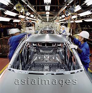 Asia Images Group - Malaysia, Kuala Lumpur, Proton auto factory, Proton cars on automated assembly line.