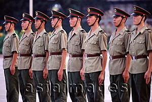 Asia Images Group - Chinese soldiers on guard duty, standing in a row