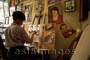 Asia Images Group - Vietnam, Hanoi, man painting in studio