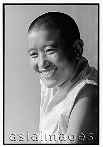 Asia Images Group - India, near Dharamsala, Dolma Ling Nunnery, Portrait of Tibetan nun smiling.