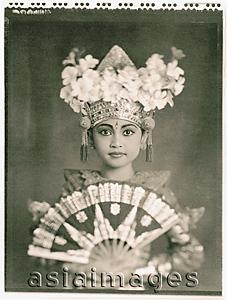 Asia Images Group - Indonesia, Bali, Amlapura, Legong dancer in full costume holding fan.