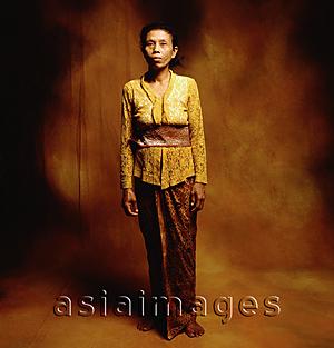 Asia Images Group - Indonesia, Bali, Ubud, Middle-aged Balinese woman in temple dress.