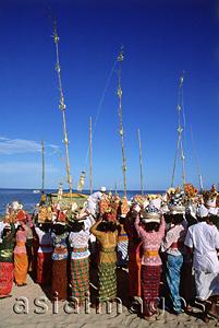Asia Images Group - Indonesia, Bali, Tanjung Benoa, Women carrying offerings at Melasti ceremony on beach. (grainy)