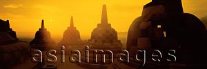 Asia Images Group - Indonesia, Java, Magelang, Sunrise across stupas on top level of Candi Borobudur. (grainy)