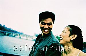 Asia Images Group - Young couple laughing. (high-grained)