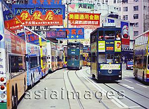 Asia Images Group - China, Hong Kong, Buses along King's Road, at Olympic Theatre, trams are passing by