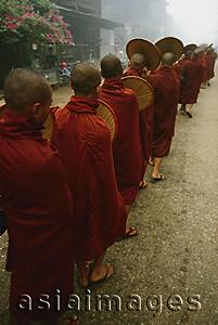 Asia Images Group - Myanmar (Burma), Bago, Line of Buddhist monks collecting alms.