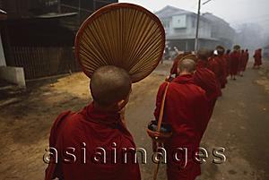 Asia Images Group - Myanmar (Burma), Bago, Buddhist monks line up to collect alms.