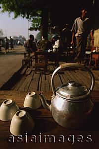 Asia Images Group - Myanmar (Burma), Pyay, Teapot and upturned cups at roadside teashop.