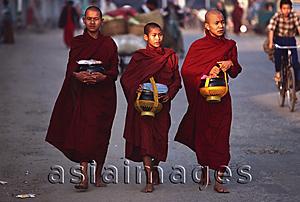 Asia Images Group - Myanmar (Burma), Sangaing, Buddhist monks returning to monastery after collecting alms.