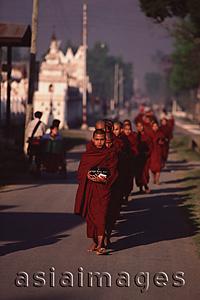 Asia Images Group - Myanmar (Burma), Nyaungshwe, Inle lake, Buddhist monks returning to monastery after collecting alms.
