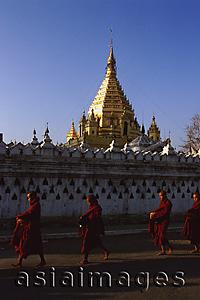 Asia Images Group - Myanmar (Burma), Nyaungshwe, Inle lake, Buddhist monks walking pass Yadanaman Aung Paya.