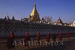 Asia Images Group - Myanmar (Burma), Nyaungshwe, Inle lake, Buddhist monks walking pass Yadanaman Aung Paya.