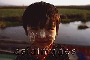 Asia Images Group - Myanmar (Burma), Inle lake, Girl with interesting bark patterns on her face.