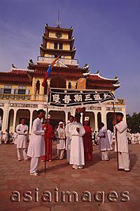 Asia Images Group - Vietnam, Tay Ninh, Funeral flag bearers and devotees outside Holy See Temple.