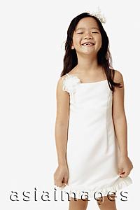 Asia Images Group - Girl in white dress, smiling