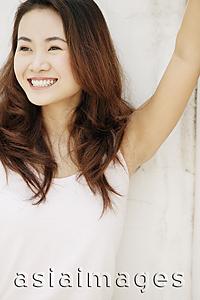 Asia Images Group - Young woman standing with arm outstretched