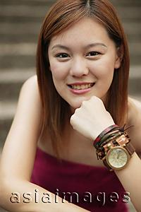 Asia Images Group - Young woman smiling, looking at camera