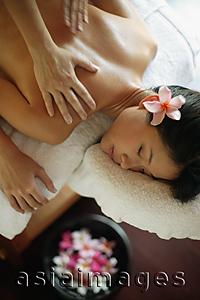 Asia Images Group - Young woman receiving back massage