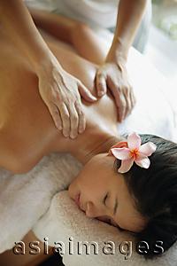 Asia Images Group - Young woman receiving back massage, eyes closed
