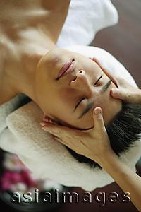 Asia Images Group - Young man receiving head massage