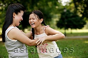 Asia Images Group - Mother holding daughter, laughing