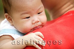 Asia Images Group - Baby being carried by father
