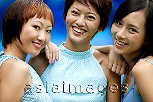 Asia Images Group - Three young women, side by side, looking at camera